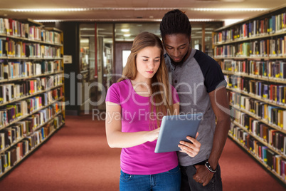 Composite image of creative team looking at digital tablet