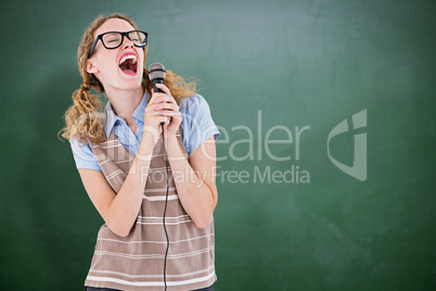 Composite image of geeky hipster woman singing into a microphone