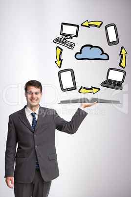 Composite image of businessman showing a book