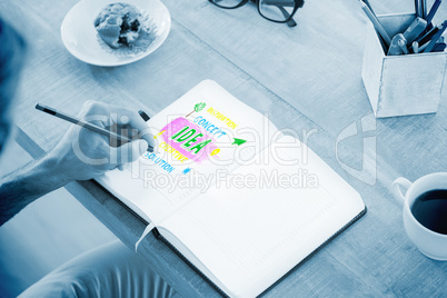 Composite image of man writing notes on diary