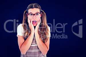 Composite image of surprised geeky hipster looking at camera