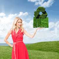 Composite image of woman holding lawn book