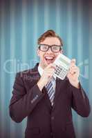 Composite image of geeky businessman pointing to calculator