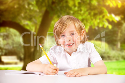 Composite image of cute pupil writing