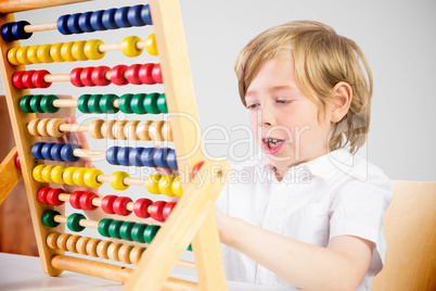 Composite image of cute pupil using abacus