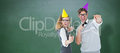Composite image of happy geeky hispser couple dancing with party