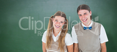 Composite image of smiling geeky hipsters looking at camera