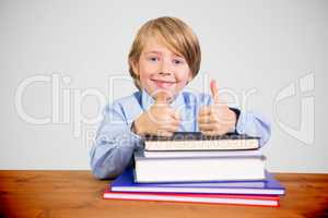 Composite image of cute pupil with books