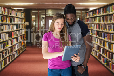 Composite image of creative team looking at digital tablet