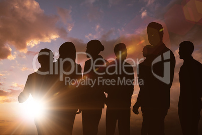 Composite image of silhouetters celebrating