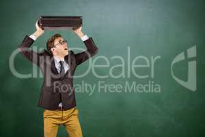 Composite image of young geeky businessman holding briefcase