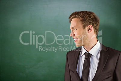 Composite image of young handsome businessman looking away