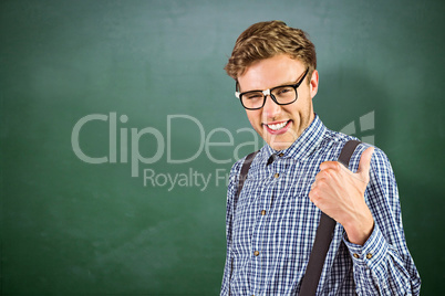 Composite image of geeky hipster showing thumbs up Composite image of geeky hipster showing thumbs up