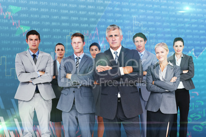 Composite image of business team standing arms crossed