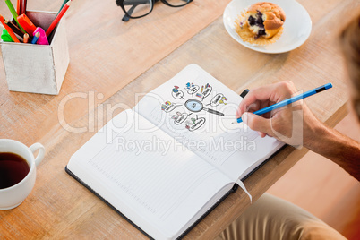 Composite image of man writing notes on diary