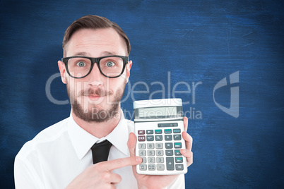 Composite image of geeky businessman pointing to calculator