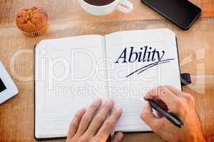 Ability against man writing notes on diary