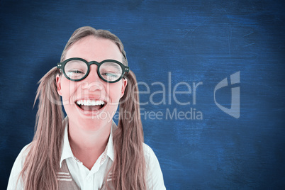 Composite image of female geeky hipster smiling at camera