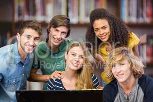 Composite image of college students using computer