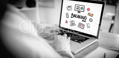 Composite image of businessman working on his laptop