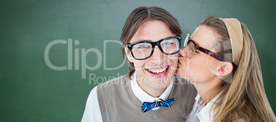 Composite image of geeky hipster kissing her boyfriend