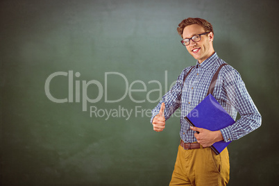 Composite image of geeky student holding a notebook