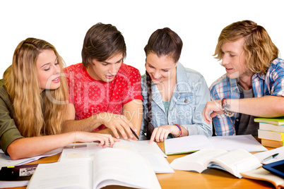 College students doing homework in library