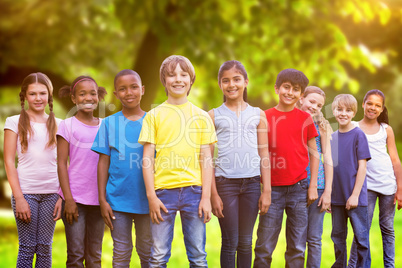 Composite image of happy friends playing in the park
