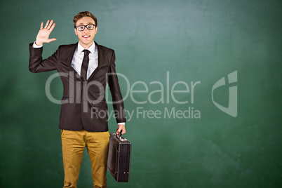 Composite image of young geeky businessman holding briefcase