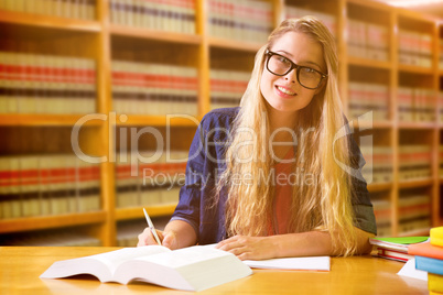 Composite image of student studying in the library