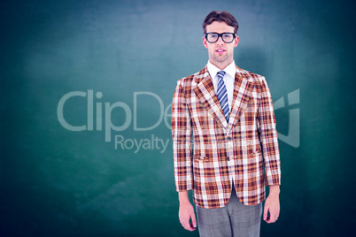Composite image of geeky hipste rlooking at camera