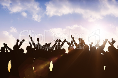 Composite image of silhouetters celebrating