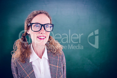 Composite image of smiling  geeky hipster girl looking at someth