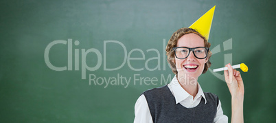 Composite image of geeky hipster in party hat with horn