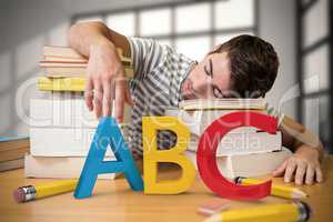 Composite image of student asleep in the library