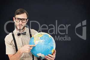 Composite image of geeky hipster holding a globe