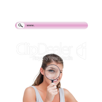 Composite image of woman looking through a magnifying glass