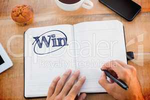 Win against man writing notes on diary