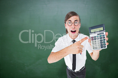 Composite image of geeky cheering businessman holding calculator