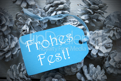 Light Blue Label On Fir Cones Frohes Fest Means Merry Christmas