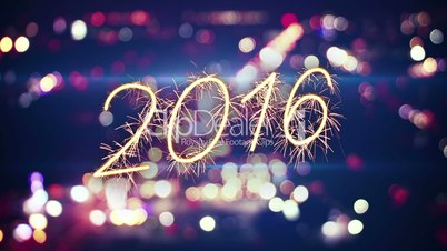 2016 new year sparkler text and city bokeh lights