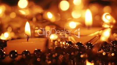 close-up burning candle and christmas lights seamless loop