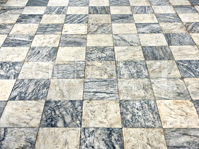 old floor of light and dark marble squares