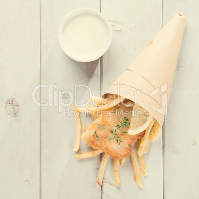 Top view fish and chips in paper cone, vintage style