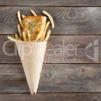 Top view fish and chips in paper cone