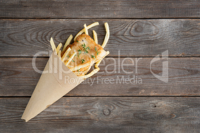Top view fish and chips wrapped in cone