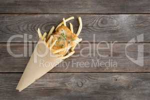 Top view fish and chips wrapped in cone