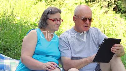 Senior couple with digital tablet pc