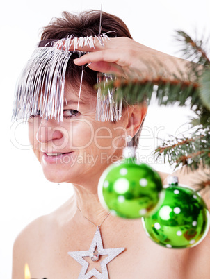 Woman adorned with tinsel for Christmas