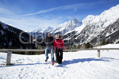 Happy couple having fun in winter landscape